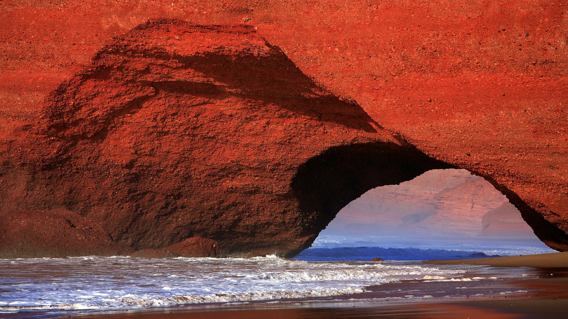 Atlantic coast and natural rock arch near El Gezira, Morocco